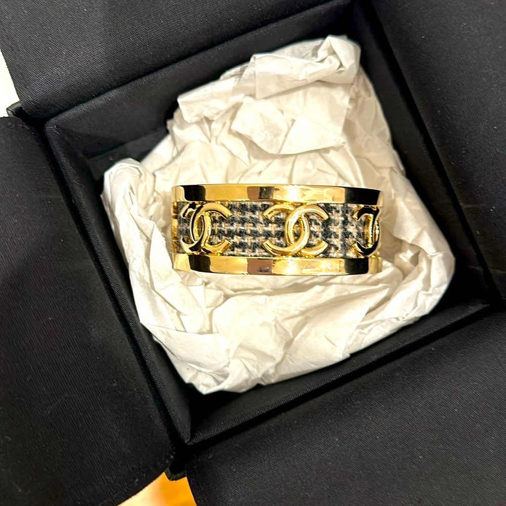 Chanel gold and tweed bracelet.